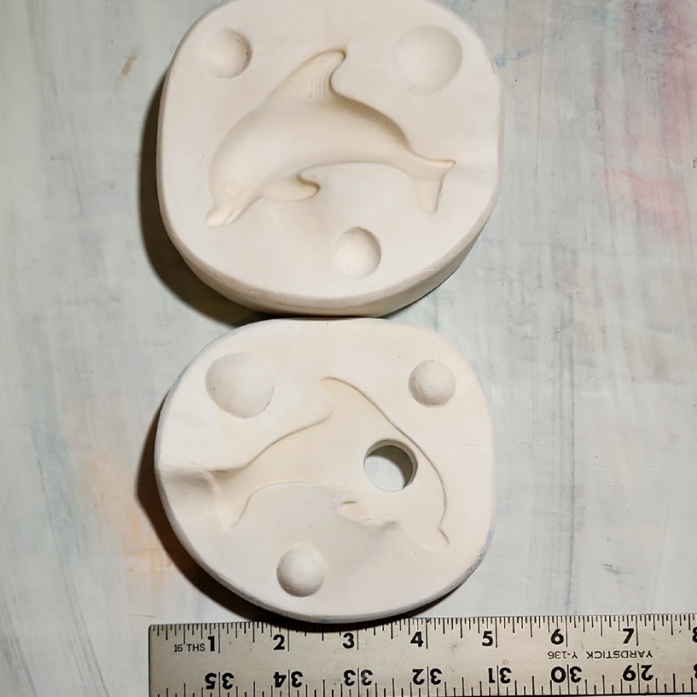 Vintage dolphin ceramic mold.